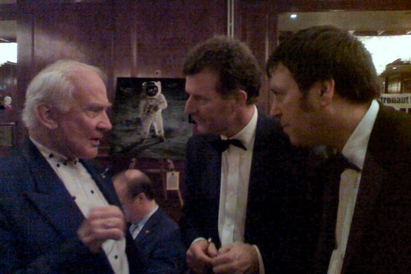 AT 003 Apollo 11 Astronaut Buzz Aldrin, Richard and Rob, London, 2007 - Buzz explaining which type of pen he used - Buzz on The Moon in the background!