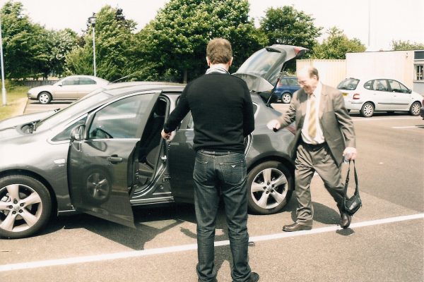 AT 054 Apollo 14 Astronaut Dr. Edgar Mitchell getting into Richard's Hire Car, Pontefract, West Yorkshire, 2010